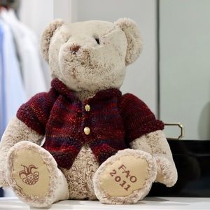 Vintage 2011 FAO Schwarz light Teddy Bear with knit sweater